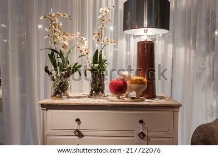 MILAN, ITALY - SEPTEMBER 13: Piece of furniture with flowers at HOMI, home international show and point of reference for all those in the sector of interior design on SEPTEMBER 13, 2014 in Milan.