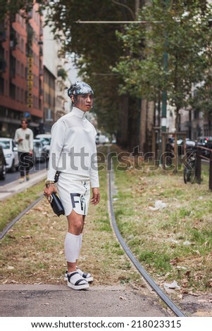 MILAN, ITALY - SEPTEMBER 17: Man poses outside Gucci fashion shows building for Milan Women\'s Fashion Week on SEPTEMBER 17, 2014 in Milan.