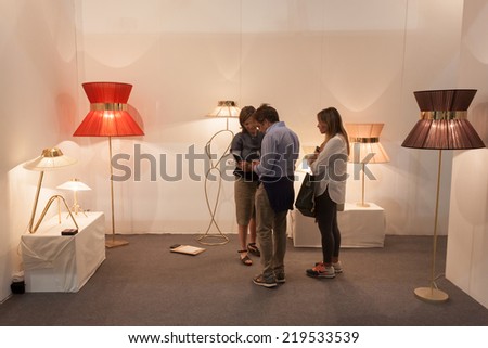 MILAN, ITALY - SEPTEMBER 13: People visit HOMI, home international show and point of reference for all those in the sector of interior design on SEPTEMBER 13, 2014 in Milan.