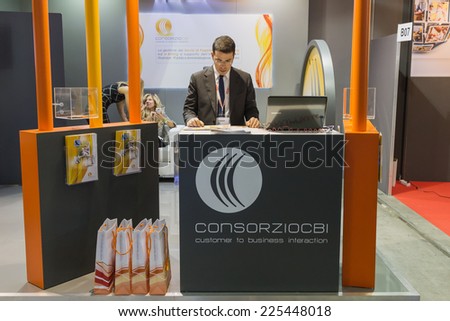MILAN, ITALY - OCTOBER 22: Exhibitor in his stand at Smau, international exhibition of information communications technology on OCTOBER 22, 2014 in Milan.