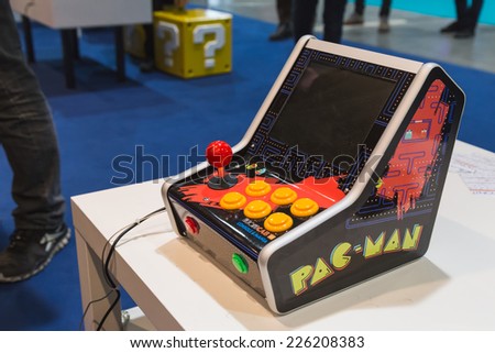 MILAN, ITALY - OCTOBER 24: Vintage Pac Man console at Games Week 2014, event dedicated to video games and electronic entertainment on OCTOBER 24, 2014 in Milan.