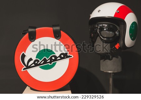 MILAN, ITALY - NOVEMBER 5: Vespa helmet with bag on display at EICMA, international motorcycle exhibition on NOVEMBER 5, 2014 in Milan.