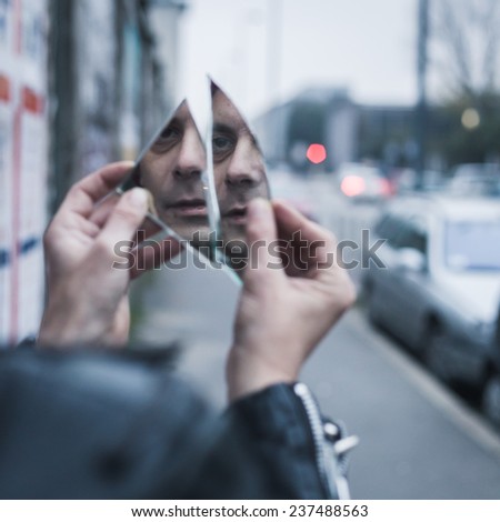 Similar – Image, Stock Photo Stylish man holding mirror with reflection