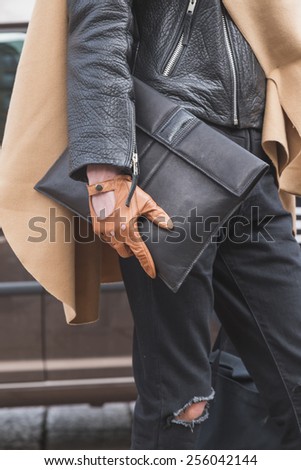 MILAN, ITALY - FEBRUARY 25: Detail of a man outside Gucci fashion show building for Milan Women\'s Fashion Week on FEBRUARY 25, 2015  in Milan.