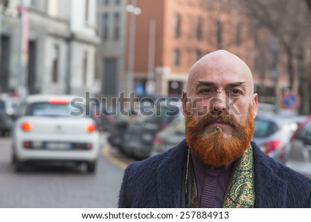 MILAN, ITALY - MARCH 2: Man poses outside Alberto Zambelli fashion show building for Milan Women\'s Fashion Week on MARCH 2, 2015  in Milan.