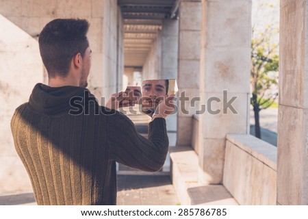 Similar – Image, Stock Photo Stylish man holding mirror with reflection