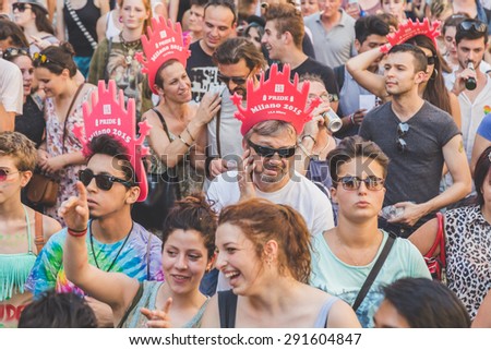 MILAN, ITALY - JUNE 27: People at gay pride parade in Milan JUNE 27, 2015. Thousands of people march in the city streets for the annual gay pride parade, claiming equality and legal rights.