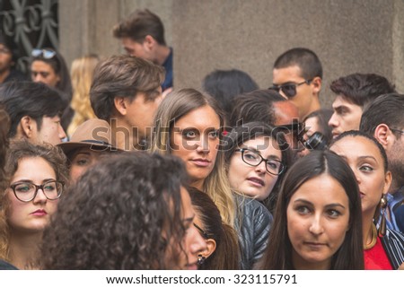 MILAN, ITALY - SEPTEMBER 27: People gather outside Trussardi fashion show building for Milan Women\'s Fashion Week on SEPTEMBER 27, 2015  in Milan.