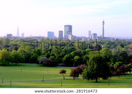 Breath-taking panoramic scenic view of London cityscape seen from beautiful Primrose Hill in St. Regents park on a sunny summer morning
