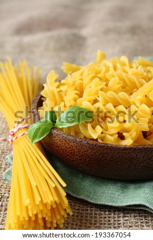 Uncooked gluten free pasta from blend of corn and rice flour