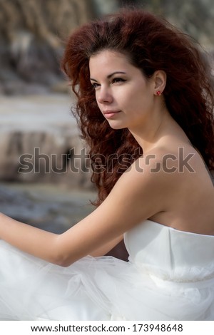 portrait of beautiful red hair bride. blurred background, outdoors