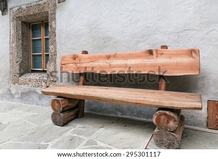 old wooden bench and a window