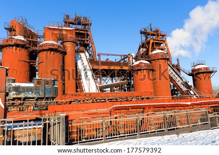 Old Steel Works against the blue cloudless sky