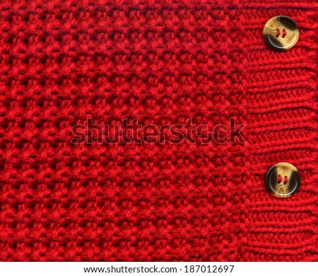 red wool knitted background with buttons