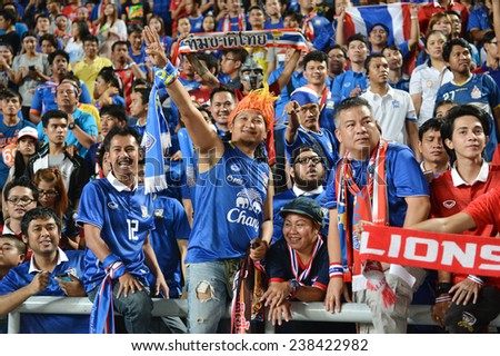 BKK,THA-DEC.16:Thai fans celebrates after won Philippine during the competition 2014 AFF Suzuki Cup between Thailand and Philippines at Rajamangala stadium on December 10, 2014 in Bangkok, Thailand.
