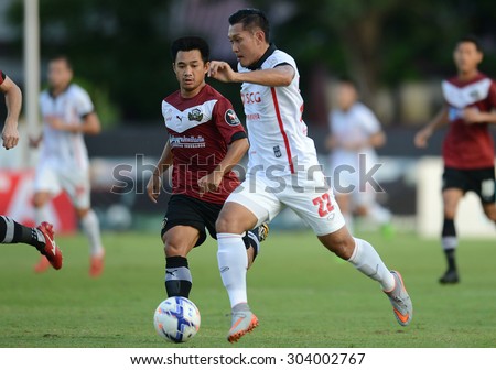 Bangkok,THA- July1: Chananan.P (R) of MTUTD in action in action during the competition League Cup 2015 between Police Utd and MTUTD at Police United Stadium on July1,2015 in Bangkok, Thailand