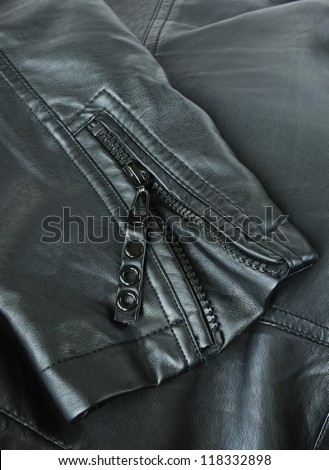 Sleeve of a leather jacket close-up