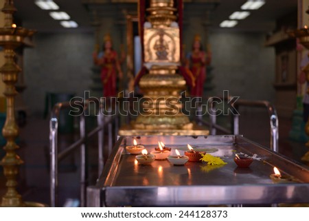 Kuala Lumpur, Malaysia - November 5, 2014: Candles in front of the altar in  Sri Mahamariamman Temple, which is the oldest Hindu temple in Kuala Lumpur.