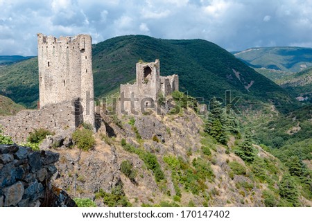 La Tour Regine and Cabaret towers on great mountains landscape at Lastours in France