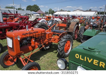 ELIZABETHTOWN, PA, USA-AUGUST 25, 2015:  Vintage Allis-Chalmers farm tractor on display at the local country fair. Many vintage farm tractors and implements graced the fairgrounds.