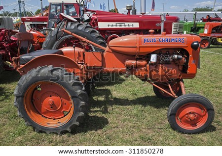 ELIZABETHTOWN, PA, USA-AUGUST 25, 2015:  Vintage Allis-Chalmers farm tractor on display at the local country fair. Many vintage farm tractors and implements graced the fairgrounds.