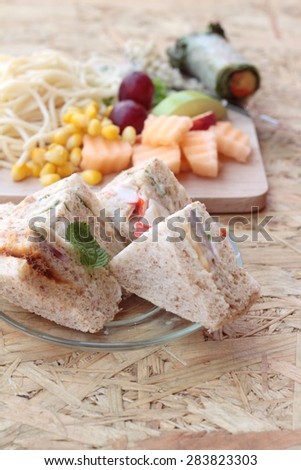 Club sandwich and pasta spaghetti with salad mix fruit