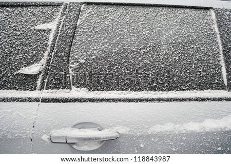 Frozen side window of  car closeup