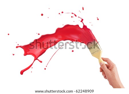 hand holding paintbrush creating red paint splash