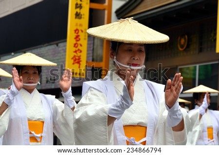 Koya, Japan - June 14, 2011: Elderly Japanese dancers in white traditional clothes during Aoba festival