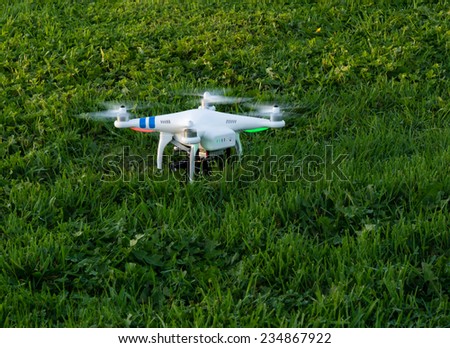 Seattle, USA - October 9, 2014: Camera drone on a grassy field before take off
