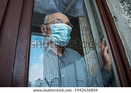Similar – Image, Stock Photo Portrait through balcony door of young blonde woman in dress and stockings