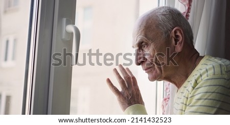 Similar – Image, Stock Photo Depressed man looking through window