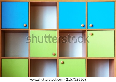 Multi colored wooden cabinet compartmentalize on cells with empty shelves front view 商業照片 © 