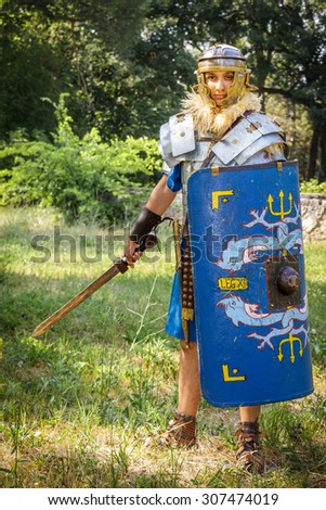 NEPTUN, ROMANIA - JULY 28, 2015 - Ancient Festival - Reenactment of the Roman and  Dacian (Thracian) wars - Roman soldier in armour (lorica segmentata) and shield