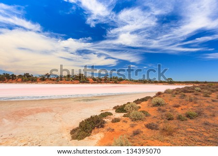 A Salt Lake in an arid and dry landscape in the Murray-Sunset National Park, Victoria Australia against blue sky with clouds veil