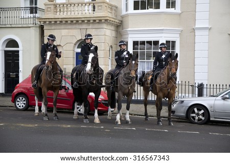BRISTOL, UK - DEC 18: Mounted police standing outside buildings on Dec 18 2014 in Bristol, UK
