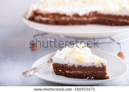 A slice of carrot cake, gluten-free, flour from rice, flax. Selective focus.