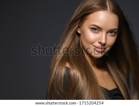 Smooth hair beauty woman smile face natural make up female healthy skin and hair glamour beauty over dark background