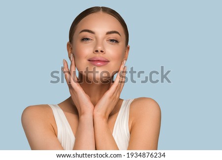 Similar – Image, Stock Photo Pretty young woman face behind a blue circle