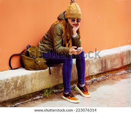 young beautiful hipster woman portrait in glasses and knitted clothes
