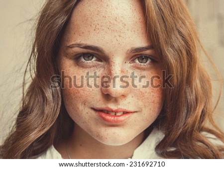 freckled hipster young beautiful woman street portrait