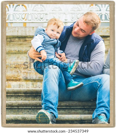 Family father with child in park walking in same clothes textile jeans jacket on step