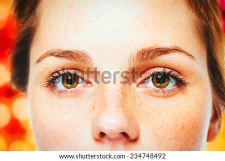 Woman Christmas  New Year eyes  portrait,  lights snow and red background