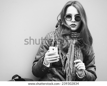 young beautiful hipster woman portrait in glasses and knitted clothes  black and white