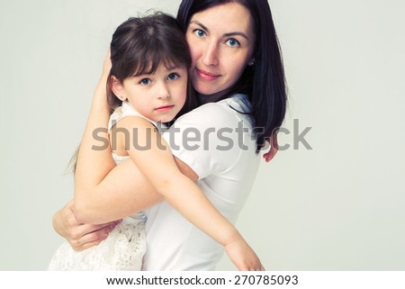 Mother with cute daughter portrait huge family studio on white