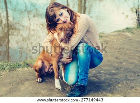 Woman with dog nature near lake