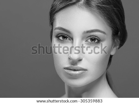 Beautiful woman face close up studio black and white