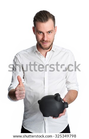 An attractive man holding a piggy bank wearing a white shirt smiling. White background.