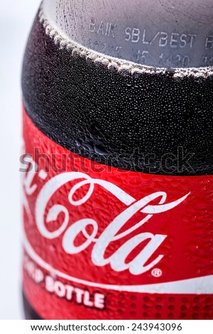 SABAH, MALAYSIA - JANUARY 13, 2015. Bottle of Coca-cola drink isolated on white. The Coca-Cola can, which dates back to 1915, is the most recognised packaging in the world today.