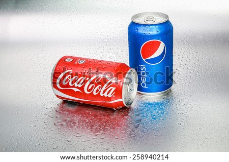 SABAH, MALAYSIA - March 08, 2015: Coca-Cola and Pepsi cans on metal background.